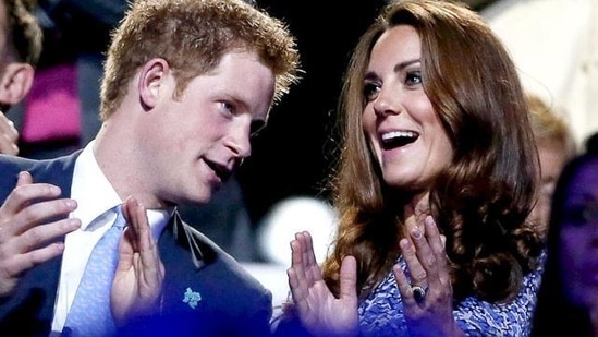 Britain's Prince Harry (L) and Dutchess of Cambridge Kate Middleton (R) applaud as they view the closing ceremony of the London 2012 Olympic Games at the Olympic Stadium. REUTERS