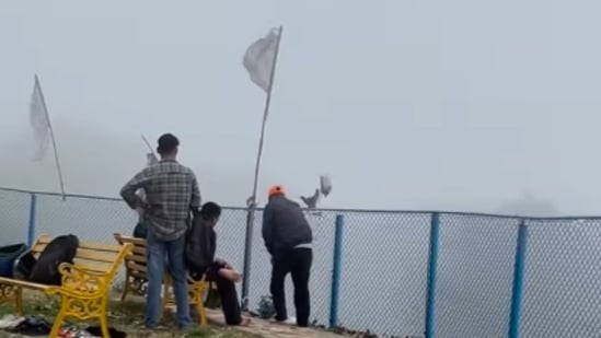 At Bhadraj Temple, a worker was filmed throwing shoes off the hillside. (Instagram/@sooraj_dogra_)