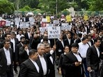 Calcutta high court advocates hold posters during a protest to condemn the rape and murder of a doctor in Kolkata on August 19, 2024. Calcutta high court advocates hold posters during a protest to condemn the rape and murder of a doctor in Kolkata on August 19, 2024.