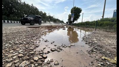 After the rain, potholes at SPR near Sector-74A. The Gurugram Metropolitan Development Authority (GMDA) has deployed special teams to repair potholes and any damaged sections on master sector roads across the city. (HT PHOTO) After the rain, potholes at SPR near Sector-74A. The Gurugram Metropolitan Development Authority (GMDA) has deployed special teams to repair potholes and any damaged sections on master sector roads across the city. (HT PHOTO)