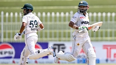 Pakistan's Mohammad Rizwan (R) and Saud Shakeel run between the wickets during the second day of the first Test against Bangladesh (AFP) Pakistan's Mohammad Rizwan (R) and Saud Shakeel run between the wickets during the second day of the first Test against Bangladesh (AFP)