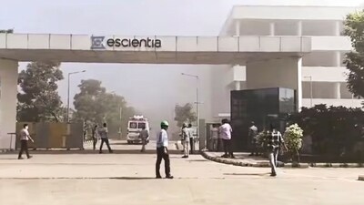 People outside the reactor pharma unit of pharmaceutical company Escientia where a fire broke out following an explosion, in Anakapalle, Andhra Pradesh, Wednesday, Aug. 21, 2024. (PTI)