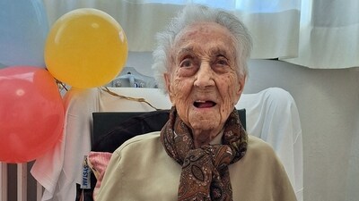 Maria Branyas, poses in front of a birthday cake on her 117th birthday in a nursing home, in Girona, Spain March. (Reuters)
