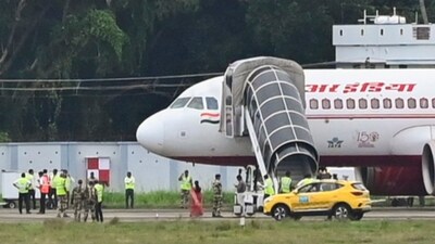 Security personnel conduct inspection of an Air India aircraft after it received a bomb threat, in Thiruvananthapuram, Thursday. (PTI) Security personnel conduct inspection of an Air India aircraft after it received a bomb threat, in Thiruvananthapuram, Thursday. (PTI)