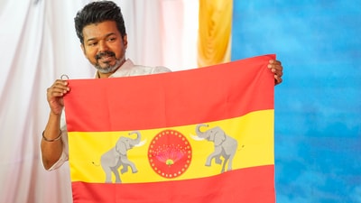 Actor-turned-politician and Tamilaga Vettri Kazhagam President Vijay unveils party's flag at party headquarters, on the outskirts of Chennai. (PTI) Actor-turned-politician and Tamilaga Vettri Kazhagam President Vijay unveils party's flag at party headquarters, on the outskirts of Chennai. (PTI)