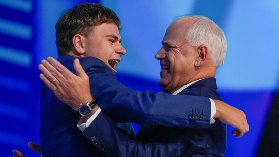 Democratic vice presidential nominee Minnesota Gov. Tim Walz hugs his son Gus during the Democratic National Convention Wednesday, Aug. 21, 2024, in Chicago. (AP Photo/Erin Hooley) (AP)