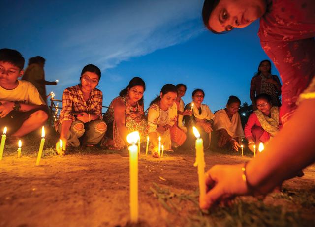 On Friday, August 16, women in Guwahati held a candle-lit march. (ANUPAM NATH/AP) On Friday, August 16, women in Guwahati held a candle-lit march. (ANUPAM NATH/AP)