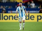 Argentina's forward #10 Lionel Messi leaves the pitch after picking up an injury.