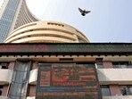 Stock market today: A bird flies past a screen displaying the Sensex results on the facade of the Bombay Stock Exchange (BSE) building in Mumbai.