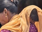 A woman covers her child with a scarf to save him from heat. (AP Photo/Rafiq Maqbool) A woman covers her child with a scarf to save him from heat. (AP Photo/Rafiq Maqbool)