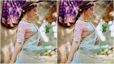 She draped a blue dupatta adorned with silver borders, letting it cascade beautifully from her shoulders, completing her glamorous outfit perfectly. (Instagram/@tamannaahspeaks) She draped a blue dupatta adorned with silver borders, letting it cascade beautifully from her shoulders, completing her glamorous outfit perfectly. (Instagram/@tamannaahspeaks)