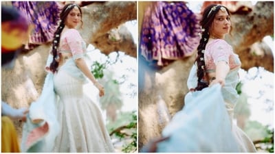She accessorised with stunning Indian jewels, including a golden choker necklace with green emeralds, a maang tikka, and delicate silver hand jewellery, making her look like an ethereal princess. (Instagram/@tamannaahspeaks) She accessorised with stunning Indian jewels, including a golden choker necklace with green emeralds, a maang tikka, and delicate silver hand jewellery, making her look like an ethereal princess. (Instagram/@tamannaahspeaks)