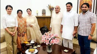 Congress leader Bhupinder Singh Hooda and his family members meet with wrestler Vinesh Phogat and her husband Somveer Rathi, at his residence in New Delhi on Friday. (ANI) Congress leader Bhupinder Singh Hooda and his family members meet with wrestler Vinesh Phogat and her husband Somveer Rathi, at his residence in New Delhi on Friday. (ANI)