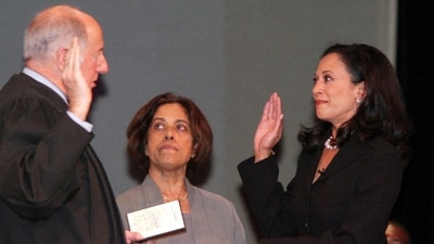 FILE - San Francisco's new district attorney, Kamala Harris, right, with her mother Dr. Shyamala Gopalan holding a copy of The Bill of Rights, receives the oath of office from California Supreme Court Chief Justice Ronald M. George, left, during inauguration ceremonies, Jan. 8, 2004, in San Francisco. (AP Photo/George Nikitin, File) (AP) FILE - San Francisco's new district attorney, Kamala Harris, right, with her mother Dr. Shyamala Gopalan holding a copy of The Bill of Rights, receives the oath of office from California Supreme Court Chief Justice Ronald M. George, left, during inauguration ceremonies, Jan. 8, 2004, in San Francisco. (AP Photo/George Nikitin, File) (AP)