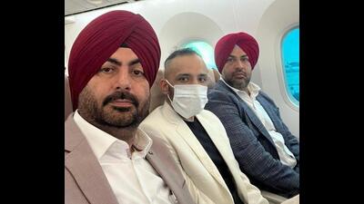 Nabha jailbreak mastermind Ramanjit Singh, alias Romy (centre), being brought back from Hong Kong by Punjab Police officers on Thursday. (X) Nabha jailbreak mastermind Ramanjit Singh, alias Romy (centre), being brought back from Hong Kong by Punjab Police officers on Thursday. (X)