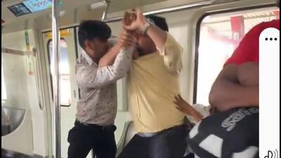 One of the videos showed men on a stationary Metro train engaged in a scuffle and threatening each other while several other passengers tried to pacify them. (HT Photo) One of the videos showed men on a stationary Metro train engaged in a scuffle and threatening each other while several other passengers tried to pacify them. (HT Photo)