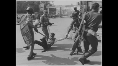 Policemen carrying away a protestor in Bihar on 31 January 1994. (HT PHOTO)
