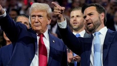 Republican presidential nominee and former US President Donald Trump (left) and Republican vice-presidential nominee JD Vance point to the stage . Republican presidential nominee and former US President Donald Trump (left) and Republican vice-presidential nominee JD Vance point to the stage .