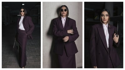 Sonam Kapoor nailed the power-dressing game in a deep plum monochrome look. She sported an oversized blazer with a light pink shirt underneath, creating a perfect contrast. Her skirt was ankle-length with a high slit. Carrying a black sling bag, she donned shades, exuding boss-lady vibes. (Instagram/@sonamkapoor) Sonam Kapoor nailed the power-dressing game in a deep plum monochrome look. She sported an oversized blazer with a light pink shirt underneath, creating a perfect contrast. Her skirt was ankle-length with a high slit. Carrying a black sling bag, she donned shades, exuding boss-lady vibes. (Instagram/@sonamkapoor)