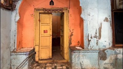 The yellow door headlines the saffron doorway, and the wall around is light blue. (HT photo) The yellow door headlines the saffron doorway, and the wall around is light blue. (HT photo)