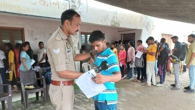 UP Police Constable Exam 2024: Candidates were checked thoroughly before the commencement of exams at a center in Varanasi. (HT Photos) UP Police Constable Exam 2024: Candidates were checked thoroughly before the commencement of exams at a center in Varanasi. (HT Photos)