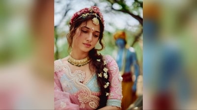 She styled her luscious tresses into soft curls, creating a middle-parted braided hairdo adorned with white flowers. The pink flower headband on top and the face-framing flicks made her look absolutely breathtaking. (Instagram/@tamannaahspeaks) She styled her luscious tresses into soft curls, creating a middle-parted braided hairdo adorned with white flowers. The pink flower headband on top and the face-framing flicks made her look absolutely breathtaking. (Instagram/@tamannaahspeaks)