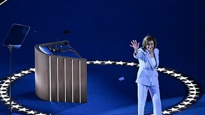 Nancy Pelosi appeared to look behind to see what she had forgotten as she readied herself to deliver her DNC remarks in Chicago prior to the keynote address by Minnesota Governor and vice presidential contender Tim Walz. (AFP via Getty Images) Nancy Pelosi appeared to look behind to see what she had forgotten as she readied herself to deliver her DNC remarks in Chicago prior to the keynote address by Minnesota Governor and vice presidential contender Tim Walz. (AFP via Getty Images)