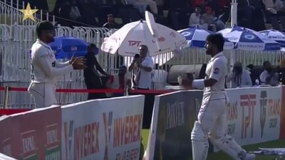 Mohammad Rizwan (R) throws bat towards Babar Azam during 1st Test (X) Mohammad Rizwan (R) throws bat towards Babar Azam during 1st Test (X)