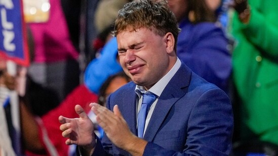 Gus Walz applauds for his father Democratic vice presidential nominee Minnesota Gov. Tim Walz speaks during the Democratic National Convention in Chicago, Aug. 21, 2024. (AP)