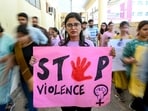 A medical professional holds a placard during a demonstration to condemn the rape and murder of a medic from Kolkata, at a hospital in Amritsar. (Narinder NANU /AFP)(AFP)