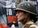 Central Industrial Security Force (CISF) personnel stands guard at the entrance of RG Kar Medical College and Hospital in Kolkata on August 23. (REUTERS)