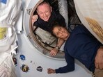 Barry 'Butch' Wilmore and Sunita Williams inside the vestibule between the forward port on the International Space Station's Harmony module and Boeing's Starliner spacecraft. Barry 'Butch' Wilmore and Sunita Williams inside the vestibule between the forward port on the International Space Station's Harmony module and Boeing's Starliner spacecraft.