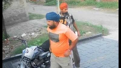 A CCTV footage shows the two assailants who came on a bike to commit the crime in Daburji village of Amritsar district on Saturday. (HT photo) A CCTV footage shows the two assailants who came on a bike to commit the crime in Daburji village of Amritsar district on Saturday. (HT photo)