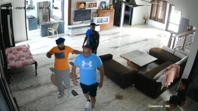 A CCTV grab of the two assailants before they opened fire on US citizen Sukhchain Singh, 43, at his house in Daburji village on the outskirts of Amritsar city on Saturday morning. The victim is hospitalised in a serious condition. (X) A CCTV grab of the two assailants before they opened fire on US citizen Sukhchain Singh, 43, at his house in Daburji village on the outskirts of Amritsar city on Saturday morning. The victim is hospitalised in a serious condition. (X)