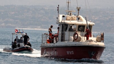 Divers of the Vigili del Fuoco, the Italian Corps. of Firefighters enter Porticello harbor near Palermo, with the body of Hannah Lynch, the last missing person at the back of the boat on August 23, 2024, four days after the British-flagged luxury yacht Bayesian sank. (Alessandro Fucarini/AFP) (AFP) Divers of the Vigili del Fuoco, the Italian Corps. of Firefighters enter Porticello harbor near Palermo, with the body of Hannah Lynch, the last missing person at the back of the boat on August 23, 2024, four days after the British-flagged luxury yacht Bayesian sank. (Alessandro Fucarini/AFP) (AFP)