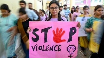 A medical professional holds a placard during a demonstration to condemn the rape and murder of a medic from Kolkata, at a hospital in Amritsar. (Narinder NANU /AFP) (AFP)
