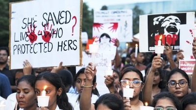 Doctors and medical students during a candlelight protest in Bengaluru. (PTI) Doctors and medical students during a candlelight protest in Bengaluru. (PTI)