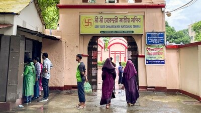 Dhaka: Visitors at the Dhakeshwari National Temple enter a gateway on the premises of the shrine at Old Dhaka area, in Dhaka, Friday, Aug. 23, 2024. (PTI)