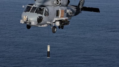 US Navy helicopter dropping airborne anti-submarine warfare (Lockheed Martin Photo) US Navy helicopter dropping airborne anti-submarine warfare (Lockheed Martin Photo)
