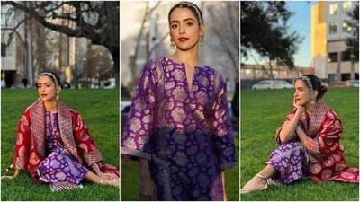 Sanya Malhotra attended the Indian Film Festival of Melbourne in a purple brocade kurta set designed by her mother. The kurta features a slit neckline, full-length trumpet sleeves, gold brocade embroidery, and a relaxed fit. She styled it with matching pants, a rani pink brocade jacket, gold matha patti, jhumkis, anklets, vibrant glam, a centre-parted bun, and juttis. (Instagram) Sanya Malhotra attended the Indian Film Festival of Melbourne in a purple brocade kurta set designed by her mother. The kurta features a slit neckline, full-length trumpet sleeves, gold brocade embroidery, and a relaxed fit. She styled it with matching pants, a rani pink brocade jacket, gold matha patti, jhumkis, anklets, vibrant glam, a centre-parted bun, and juttis. (Instagram)