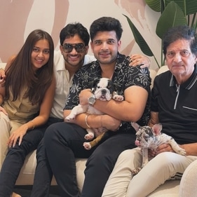 Karan Kundrra and Tejasswi Prakash with their family and pets Daku and Majnu. Karan Kundrra and Tejasswi Prakash with their family and pets Daku and Majnu.
