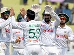 Bangladesh's Mehidy Hasan Miraz (C) celebrates with teammates after taking the wicket of Pakistan's Mohammad Rizwan (not pictured) during the fifth and final day of the first Test cricket match Bangladesh's Mehidy Hasan Miraz (C) celebrates with teammates after taking the wicket of Pakistan's Mohammad Rizwan (not pictured) during the fifth and final day of the first Test cricket match