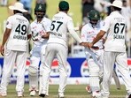 Bangladesh's Shadman Islam (2L) and Zakir Hasan (2R) shake hands with Pakistan's players after their team's win at the end of the fifth and final day of the first Test cricket match. Bangladesh's Shadman Islam (2L) and Zakir Hasan (2R) shake hands with Pakistan's players after their team's win at the end of the fifth and final day of the first Test cricket match.