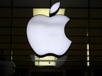 The Apple logo is illuminated at a store in the city center in Munich, Germany, on Dec. 16, 2020. (Matthias Schrader/AP)