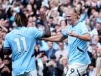 Manchester City's Erling Haaland celebrates scoring their third goal with Jeremy Doku.