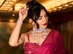 Priyanka Chopra wears a diamond bracelet and vintage pearl necklace by Bulgari to her brother's wedding. 