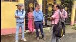 CBI officials outside the residence of former principal of RG Kar Medical College Sandip Ghosh in Kolkata on Sunday. (PTI)