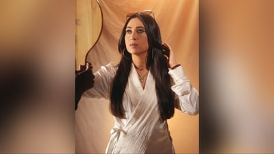 With the assistance of hair stylist Radhika Yadav, Karisma styled her long, luscious tresses into soft curls, parted in the middle. Her hair elegantly framed her face and cascaded gracefully down her shoulders. (Instagram/@therealkarismakapoor) With the assistance of hair stylist Radhika Yadav, Karisma styled her long, luscious tresses into soft curls, parted in the middle. Her hair elegantly framed her face and cascaded gracefully down her shoulders. (Instagram/@therealkarismakapoor)