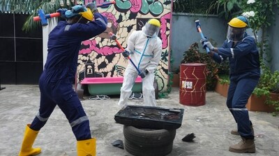 People wearing protective gear use sledgehammers to break a television set to vent their anger outside the Shadow Rage Room in Lagos, Nigeria, Sunday, July 28, 2024. (AP Photo/Sunday Alamba) People wearing protective gear use sledgehammers to break a television set to vent their anger outside the Shadow Rage Room in Lagos, Nigeria, Sunday, July 28, 2024. (AP Photo/Sunday Alamba)