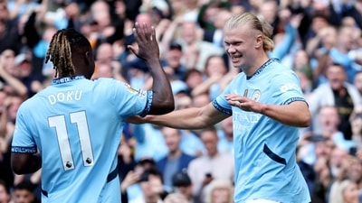 Manchester City's Erling Haaland celebrates scoring their third goal with Jeremy Doku. (Action Images via Reuters)
